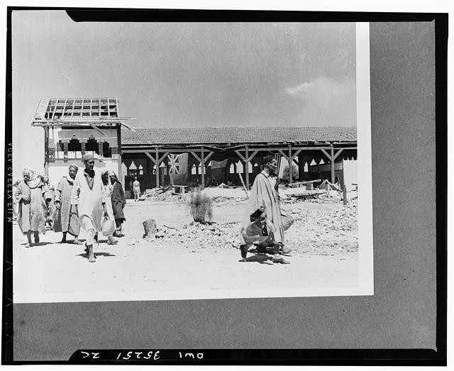 Photo:Aden Yemen 1910s Men in Robes Beside Damaged Building Street Scene