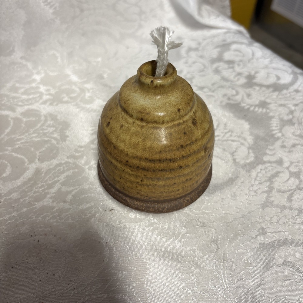 Signed J. Mills 1982 studio pottery oil lamp with yellow-brown glaze.
