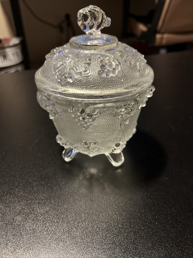 Elegant crystal candy dish with lid and decorative footed base
