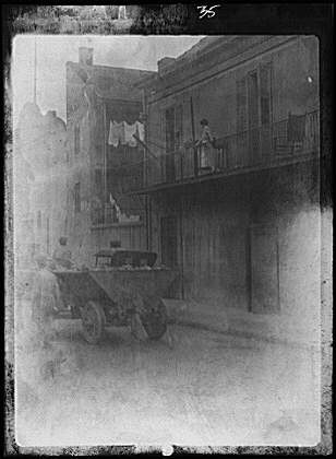 Street scene,buildings,cars,roads,New Orleans,Louisiana,LA,Arnold Genthe,1920