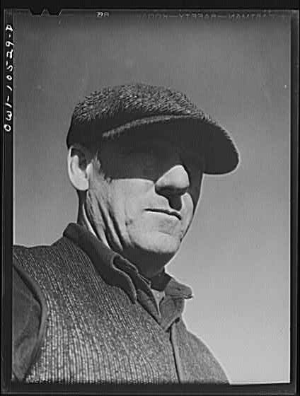 Photo:1920s Man in Flat Cap Portrait Close Up