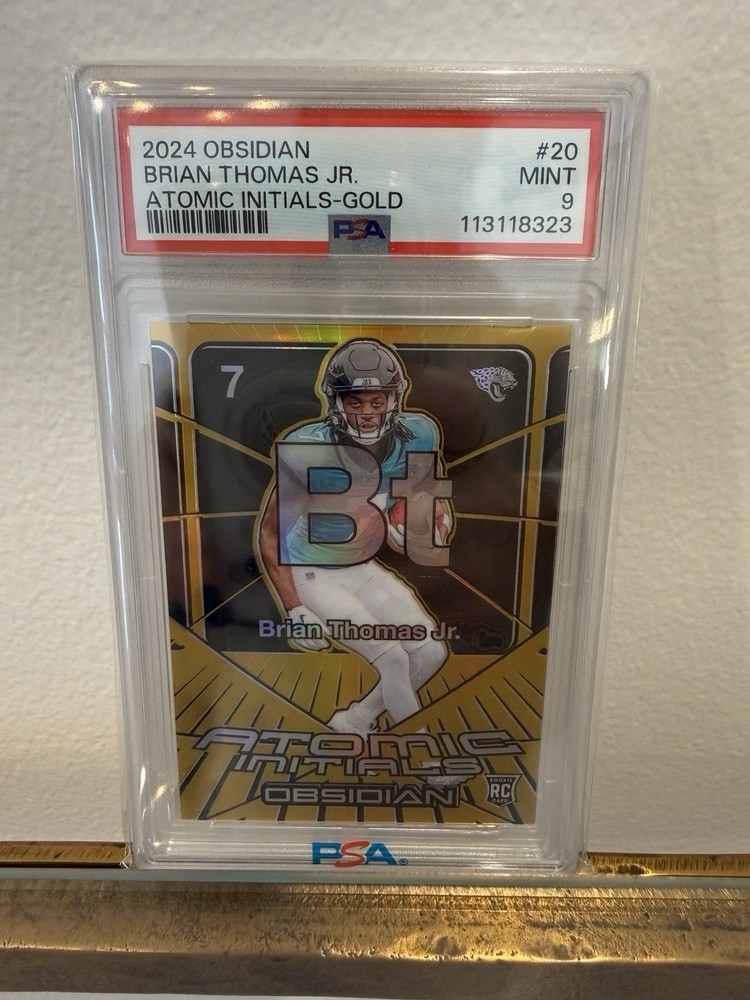 2024 Panini Obsidian - Atomic Initials Brian Thomas Jr. #20 Gold /10 (RC)
