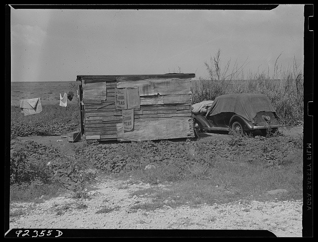 Photo:1930s Beach Shack Old Car Clothesline Shanty on Shore