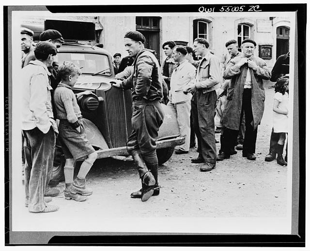 Photo:France 1940s German Soldiers Civilians Jeep Occupation Street Scene