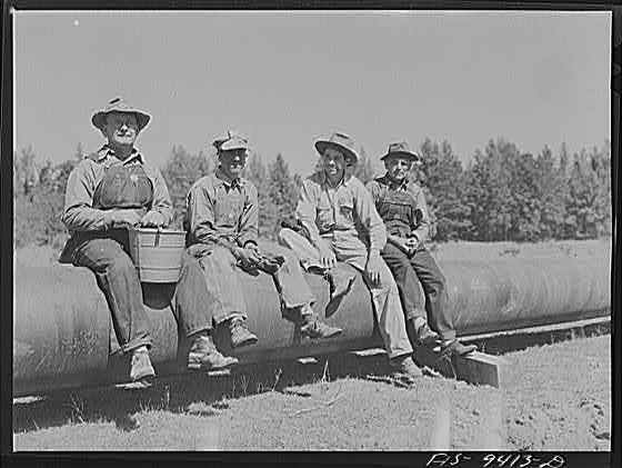 Photo:Longview Texas 1942 War Emergency Pipeline Workers on Pipe