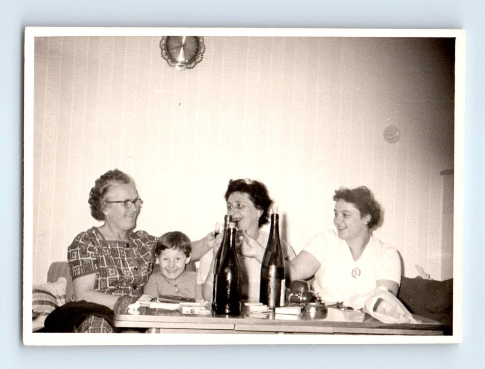 Old Vintage Photo WOMEN AND BOY SITTING ON COUCH COFFE TABLE WINE BOTTLES