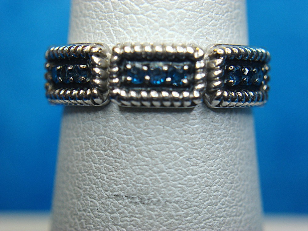 STERLING SILVER BAND RING WITH BLUE CZs - SIZE 6