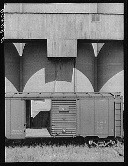 Photo:Grain elevators and freight car. Minneapolis, Minnesota