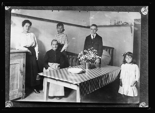 Photo:Refugees American Red Cross Quarters 1910s Family Interior Scene