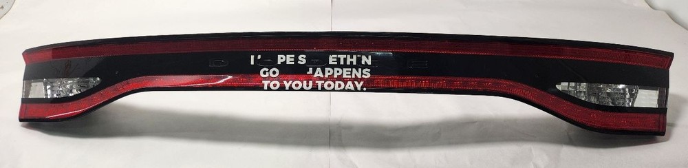 Used Center Tail Light Assembly fits: 2013 Dodge Dart center w/illuminated surro