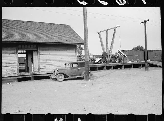 Photo:1930s Railroad Flatcar Unloading Wooden Building Truck Yard Scene