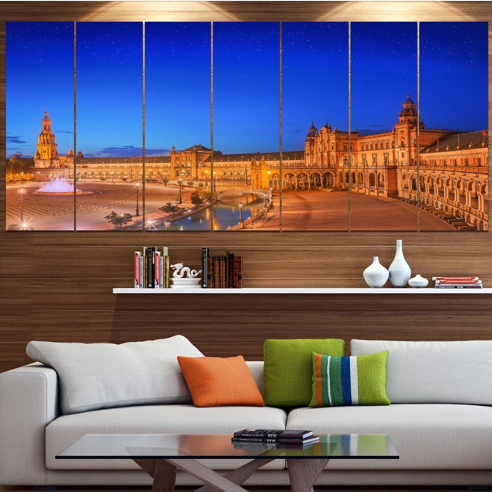 Experience the breathtaking beauty of Spain with the Designart Modern Cityscape Oversized Canvas Print, showcasing a stunning View of Spain Square at Sunset.