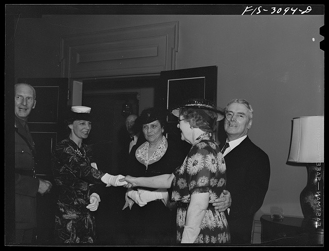 1930s 1940s Fashionable Women Handshake Party Portrait Men Hat Gloves