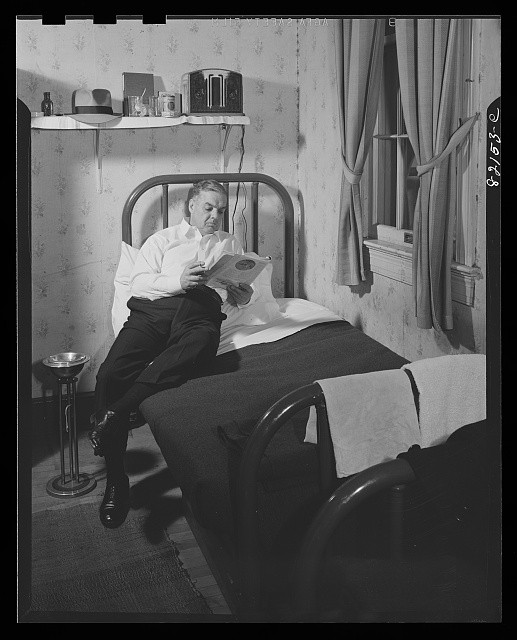 Washington DC Self-Help Client in Room 1942 Reading in Self-Help House