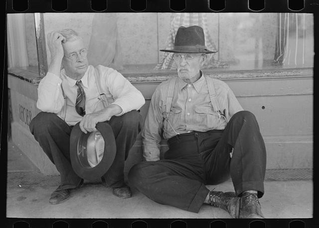 Photo:Spur Texas 1939 Farmers Sitting on Sidewalk Men Against Wall