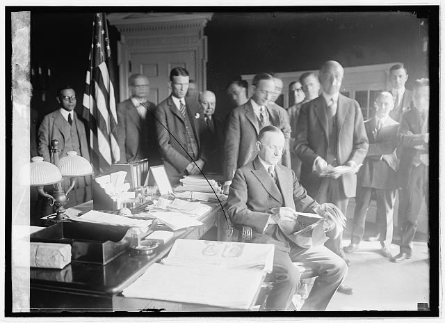 President Calvin Coolidge with newspaper men?,11/24,American Politician,1924