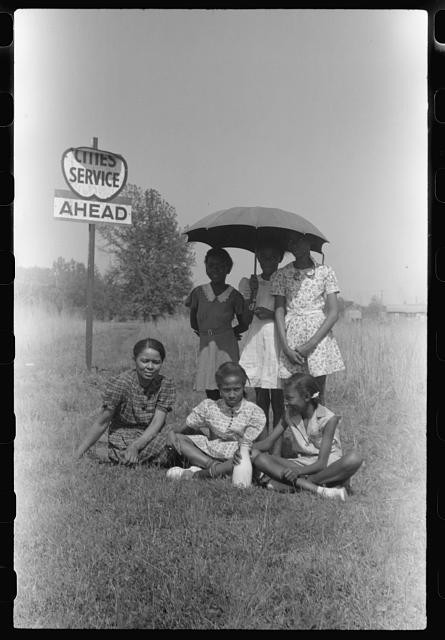 Photo:1930s African American Girls Umbrella Roadside Service Ahead Sign