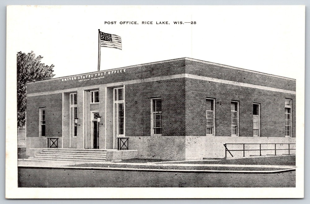 Rice Lake Wisconsin~Post Office Bldg Street View~US Flag~B&W~Vintage Postcard