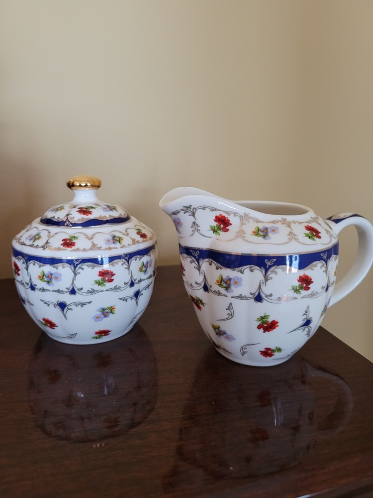 Grace Teaware cream and sugar set. Red and blue flowers w Gold trim