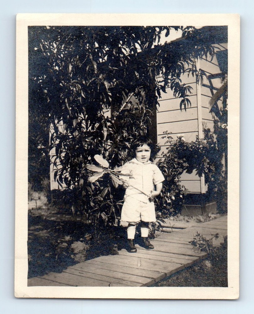 Old Vintage Photo SOLO BOY STANDING ON WALKWAY OUTSIDE HOUSE SNAPSHOT PICTURE