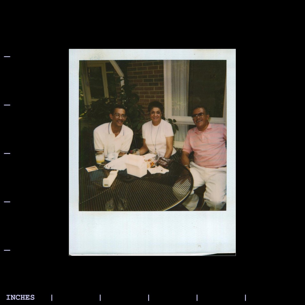 Old Polaroid Photo MAN WOMAN SITTING AROUND TABLE