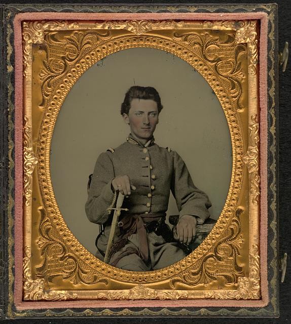 Photo:[Unidentified soldier in Confederate uniform with sword]