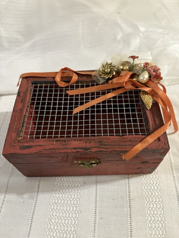 Victorian-style wooden keepsake box with ornate detailing