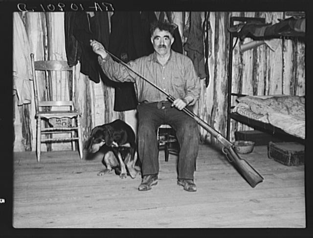Photo:Black Aleck Dickinson Iron County Michigan 1937 with Dog Snoop FSA