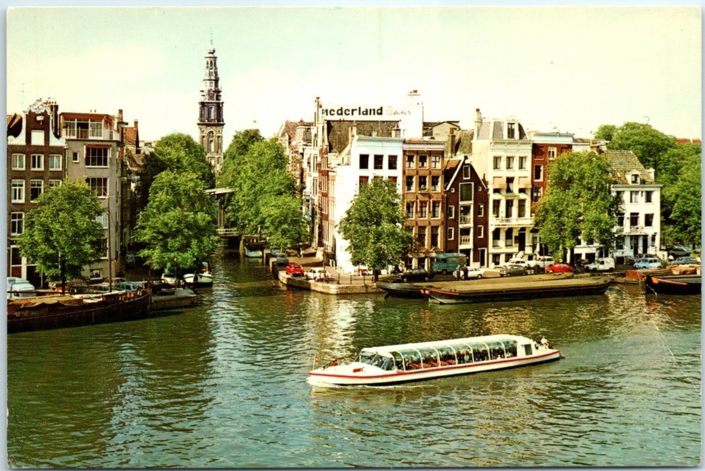 Postcard - The Amstel river and Southern Church - Amsterdam. Netherlands