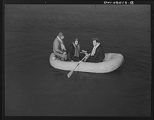 Photo:1940s Men in Inflatable Raft Rowing on Water