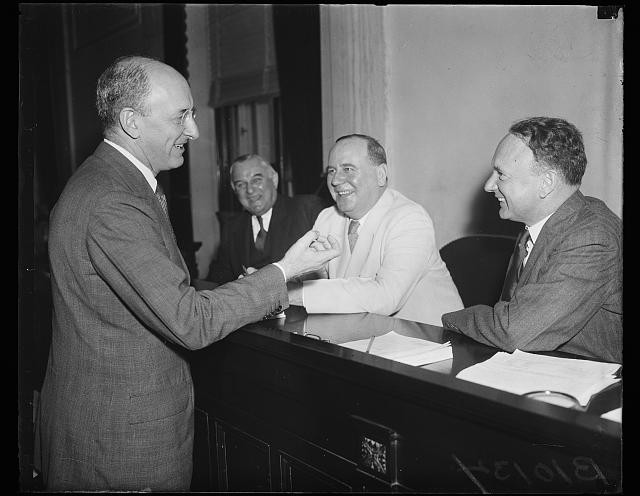 Photo:Henry Morgenthau 1936 men at desk smiling meeting