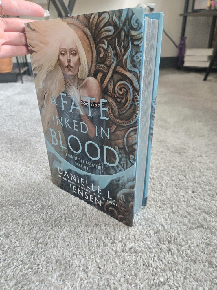 Deluxe edition of A Fate Inked in Blood by Danielle L. Jensen with Sprayed Edges