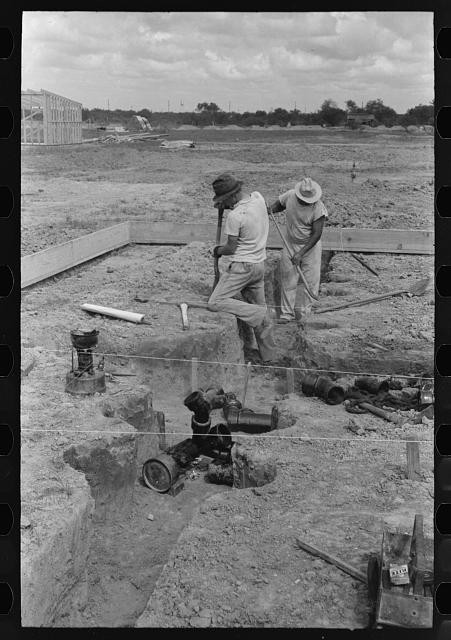 Photo:Sinton Texas 1939 Migrant Camp Sewer Pipe Soldering Workers
