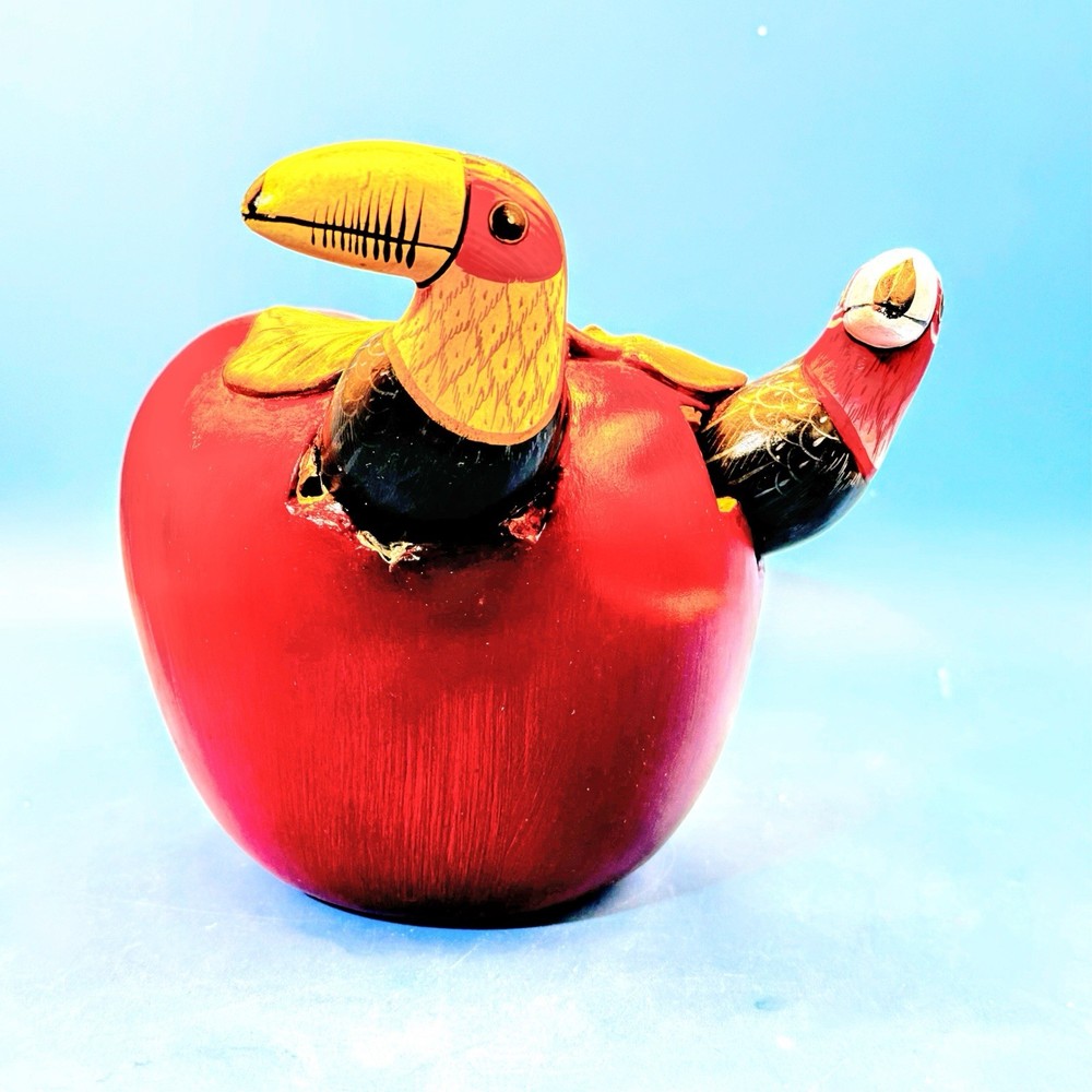 Folk art ceramic toucan sculpture by Teodoro Valdovinos with red apple