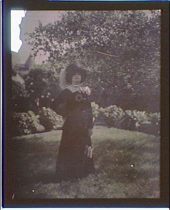 Photo:Woman in Garden Black Dress White Plume Hat 1910s Portrait Photo