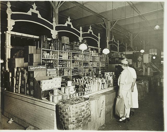 Photo:1920s Grocery Store Woman Shopping Canned Goods Market Interior