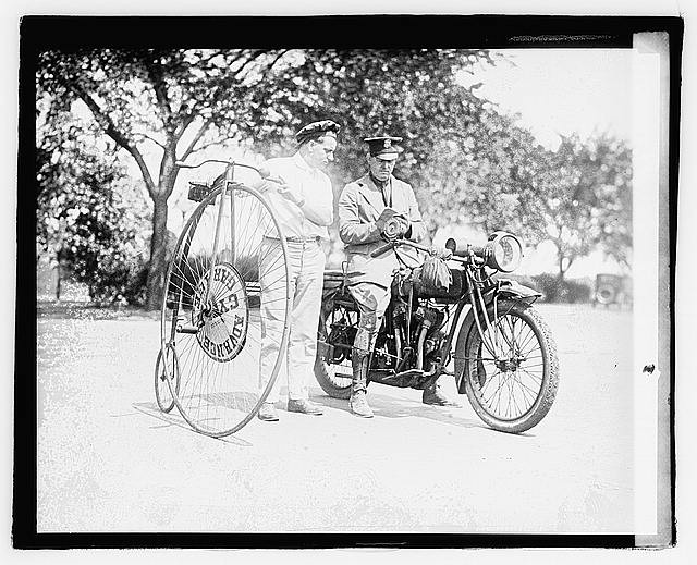 Photo:1921 Man with Velocipede and Motorcycle Outdoors