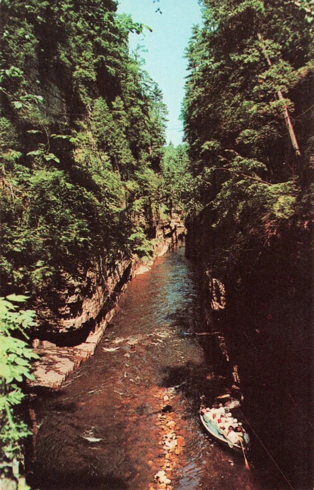 A Boat passing through Famous Ausable Chasm - Ausable Chasm New York NY Postcard
