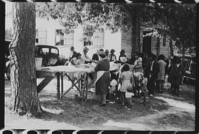 Yanceyville North Carolina 1940s Farm Security gathering with crowd and cars