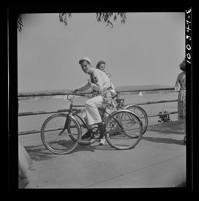 Photo:Bicycle Riders Waterfront Promenade 1930s Sailboats