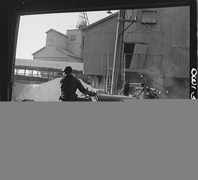 Photo:Industrial Grain Elevator Man Bicycle 1900s Black and White Photo