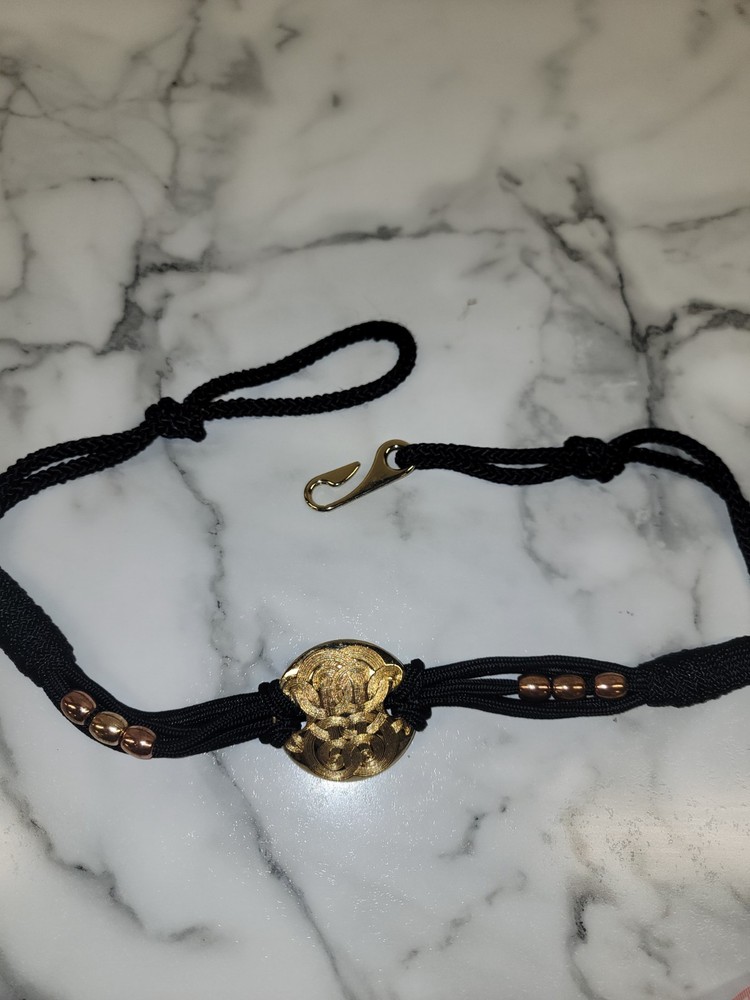 Vintage 1980's gold disc and black cord belt