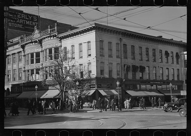 Photo:Downtown Storefront Street Scene 1930s Crowds Streetcar Tracks Car