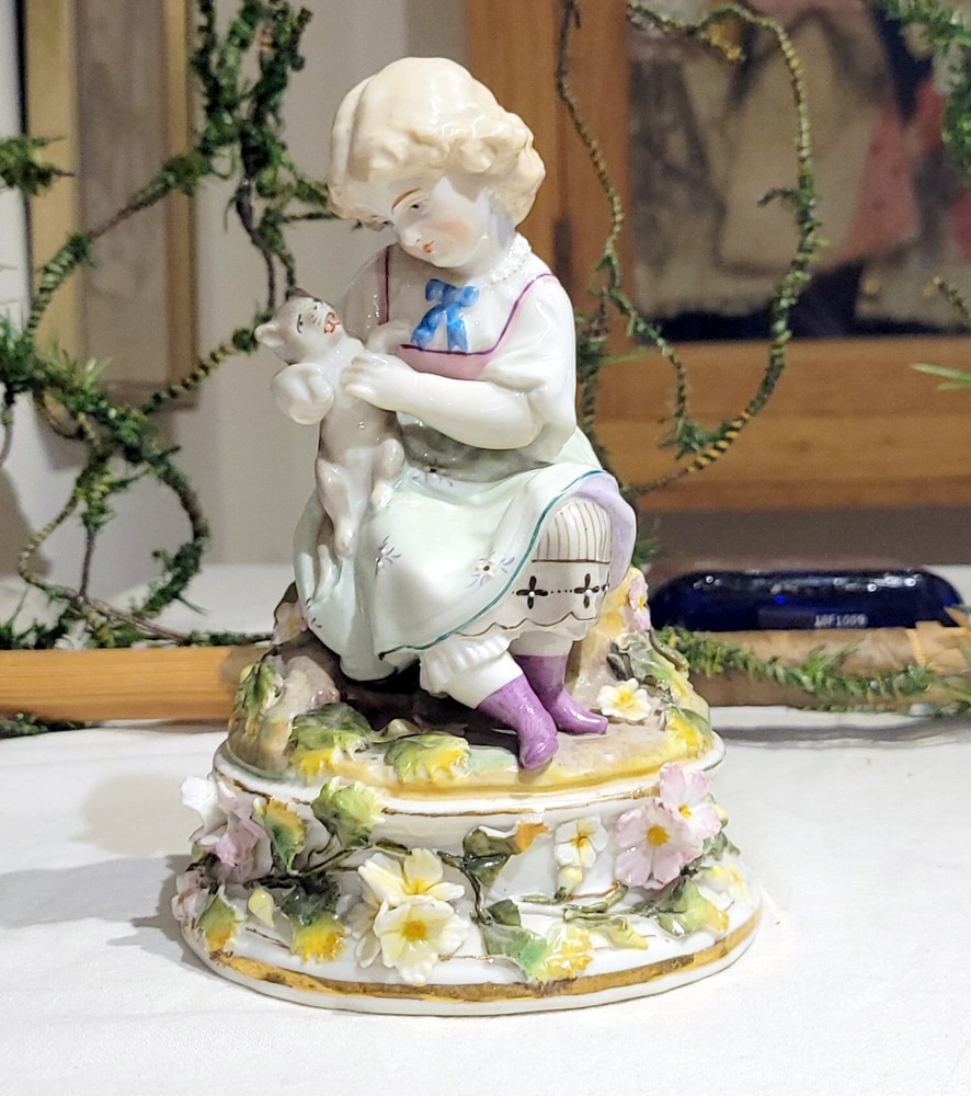 Antique 19th-Century German Bisque Porcelain Figurine. Girl holding her Cat.