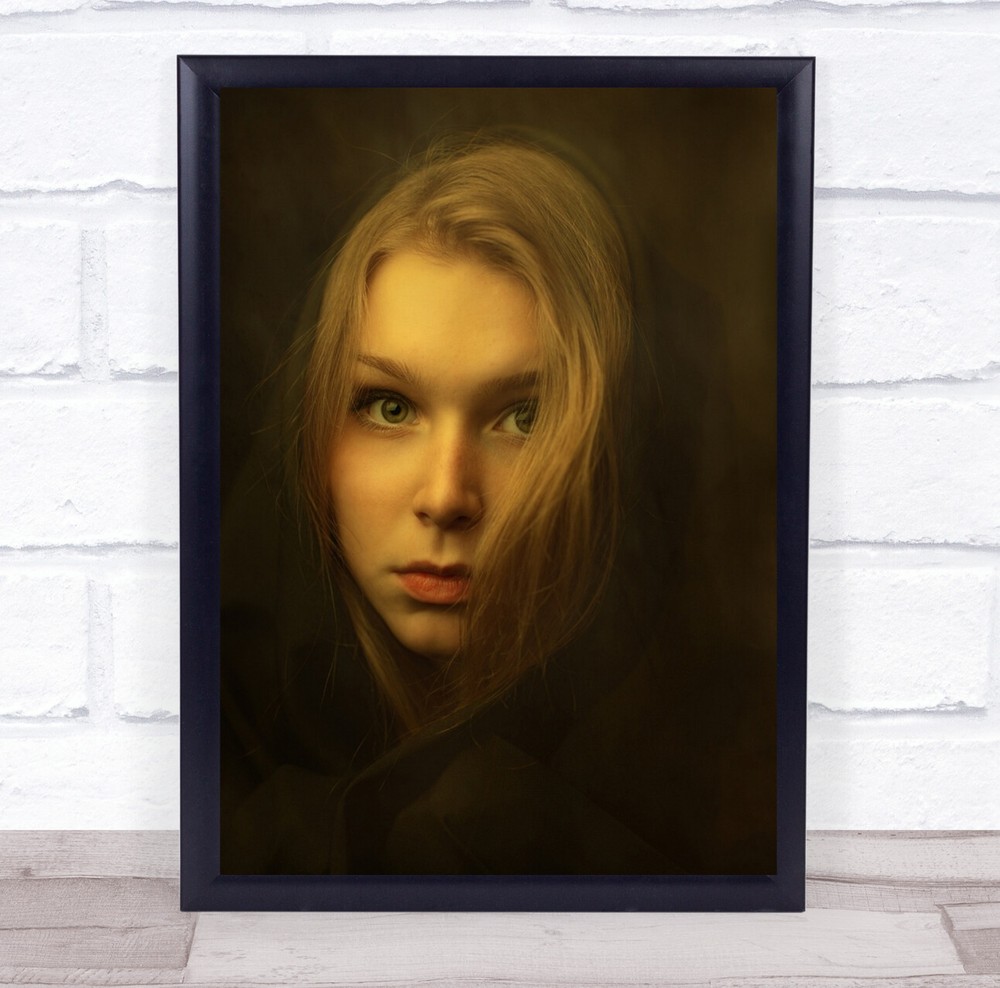 Woman stare orange light head shot Wall Art Print