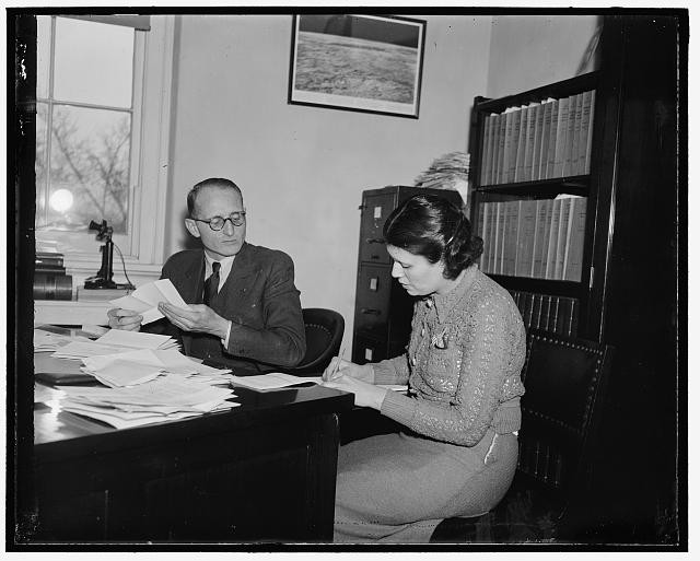 Photo:1930s Man Woman Office Desk Paperwork Interior Photograph