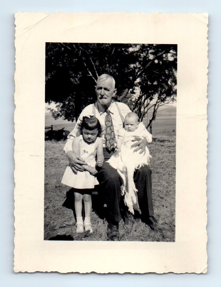 Old Vintage Photo GIRL NEXT TO MAN SITTING IN CHAIR HOLDING BABY SNAPSHOT