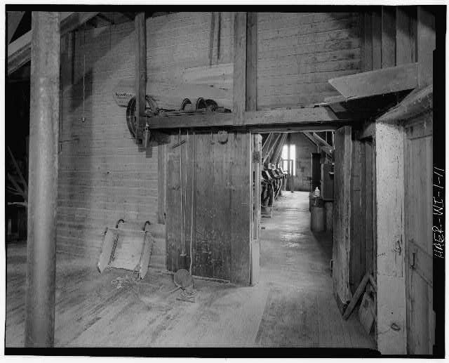 11. Interior view first floor showing power shovel left doorway used unload