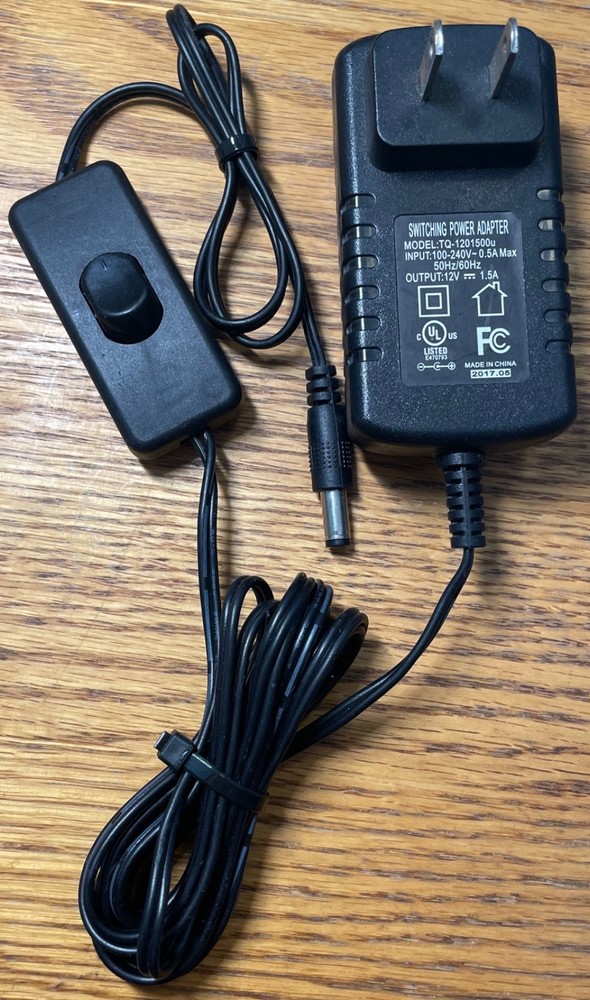 12V 1.5A Switching Power Adapter Model: TQ-1201500u Input: 100-240V~ 0.5A Max
