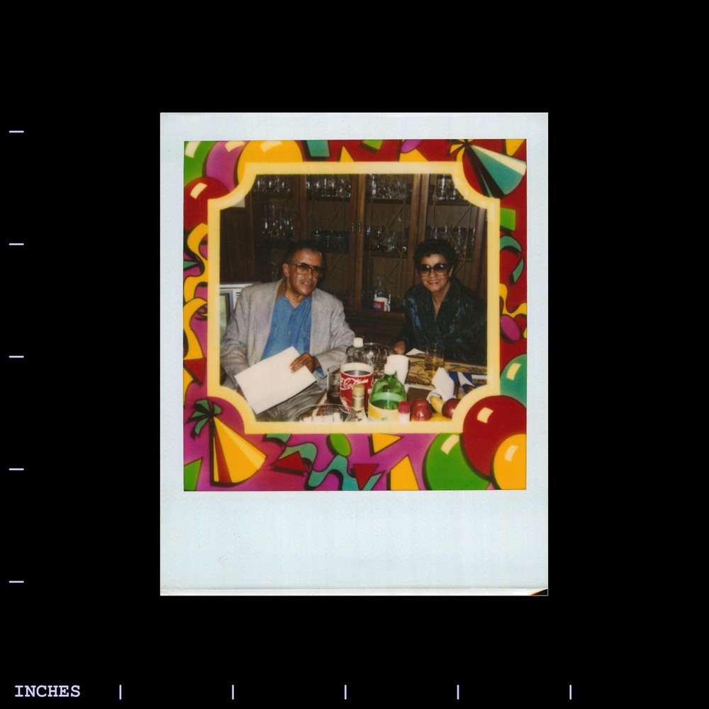 Old Polaroid Photo MAN WOMAN SITTING AROUND TABLE
